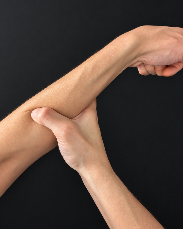 Fist and wrist turned sideways while forearm contact is maintained.